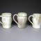 Trio of fluted porcelain mugs
