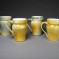 Multi-colored mustard mugs with cream glaze inside, stoneware