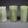 Trio of green porcelain fluted vases.