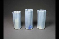 Trio of blue porcelain fluted vases.